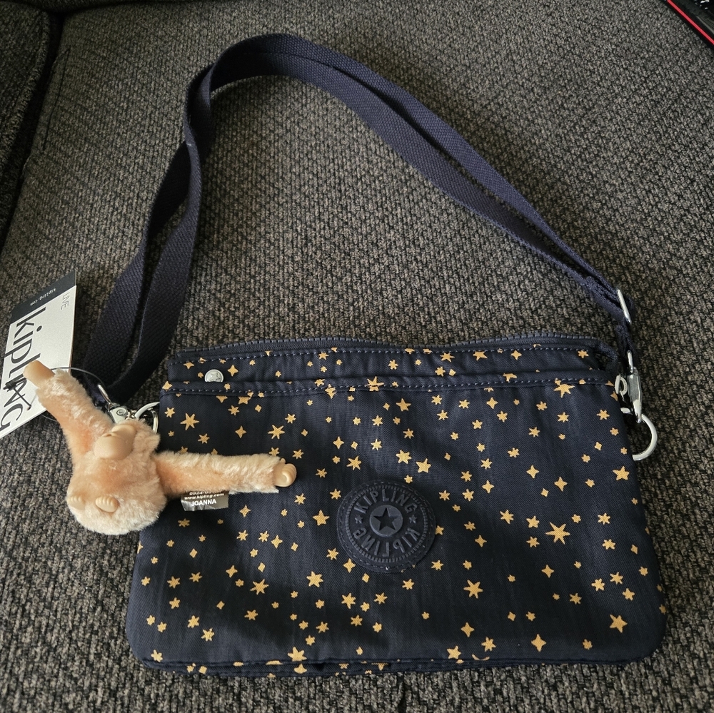 Kipling Navy Crossbody Bag with Gold Star Print and Monkey Charm